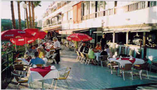 Beach restaurants and outdoor life follows from a holiday appartment in Spain.